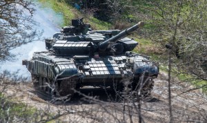 A Russian tank rolls outside a former Ukrainian military base in Perevalnoye, near the Crimean capital Simferopol.